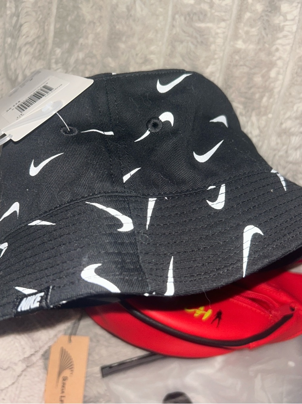 Nike Kids Black Bucket Hat with White Swoosh Pattern
